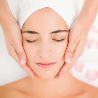 attractive woman receiving facial massage spa center 13339 256034 e1550949595894