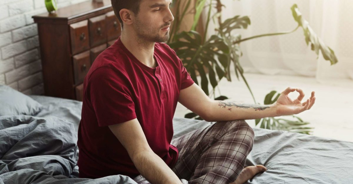 meditate-on-bed - Natural Touch Training™ - Premier Training & Accreditation in Massage, Beauty, Wellbeing and Personal Development in the UK